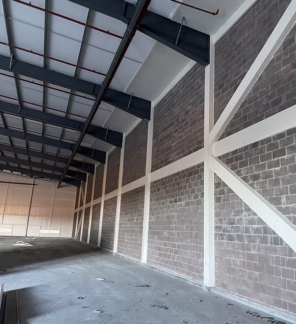 Fire boarding installation protecting structural elements in a commercial building